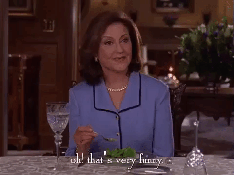 Emily Gilmore sitting at a dinner table and saying "oh! that's very funny."