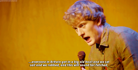 Gif of comedian James Acaster talking about how the British got into boats and proceded to rob the entire planet.