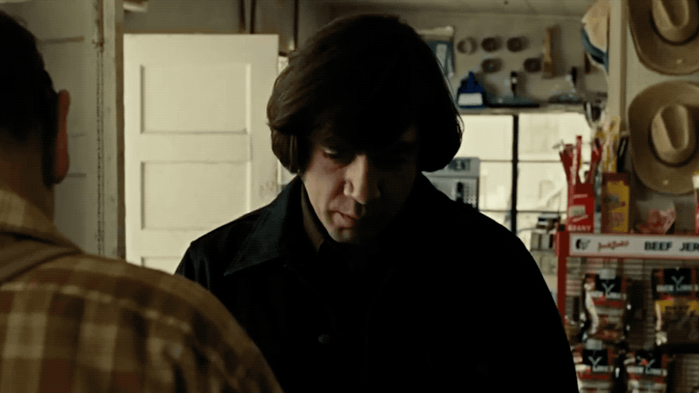 A GIF of the character of Anton Chigurh from No Country for Old Men staring directly at the camera thanks to the adjustment by AI.
