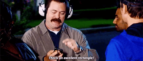 a man with a mustache is wearing headphones and holding a cell phone .