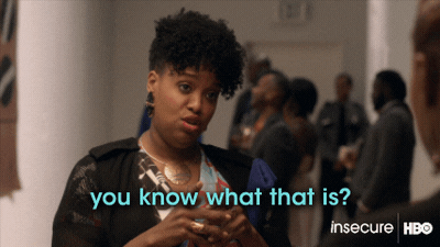 Black woman in conversation, holding glass in one hand gesturing with other: "You know what that is? Growth."