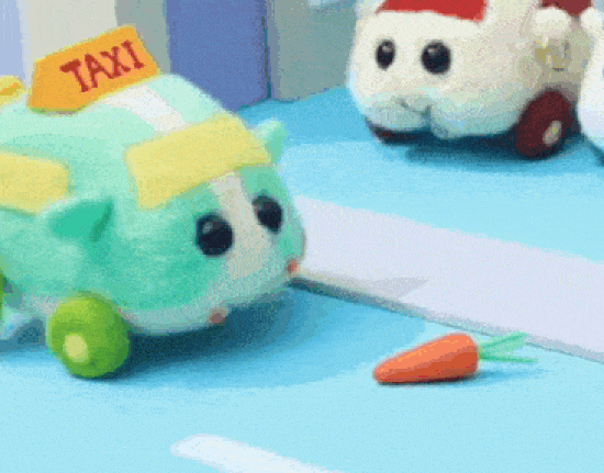 Gif of stop-motion animation showing a green felt guinea pig that is a taxi, ambling along a road and eating a trail of carrots. Don't overthink it. They're guinea pigs, and they're also cars. Gif of stop-motion animation showing a green felt guinea pig that is a taxi, ambling along a road and eating a trail of carrots. Don't overthink it. They're guinea pigs, and they're also cars.