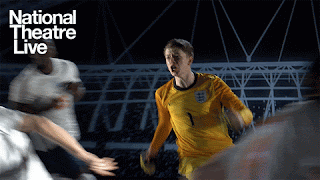 A gif from the promotion of Dear England at the National Theatre. The actor playing Jordan Pickford, the England goalkeeper, is in his kit, running in passionate celebration away from the goal. There are other actor in football kits in the background. They are all running and moving about energetically.