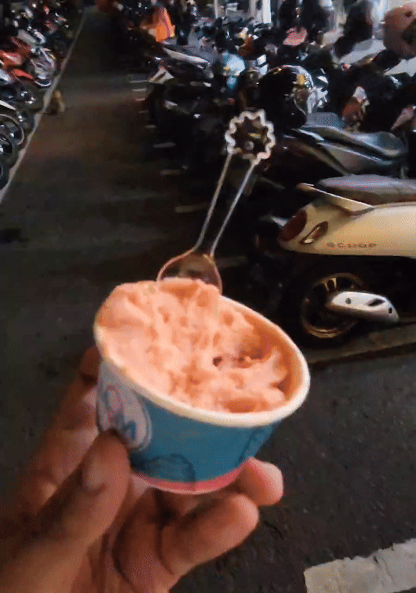 Hand holding gelato ice cream
