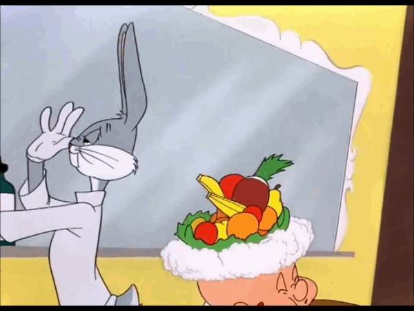 Gif con Bugs Bunny in veste da parrucchiere: è girato di spalle rispetto a Taddeo, seduto con la schiuma in testa. Bugs Bunny lancia dei frutti sulla sua testa. Sullo sfondo giallo compare uno specchio grigiastro.
