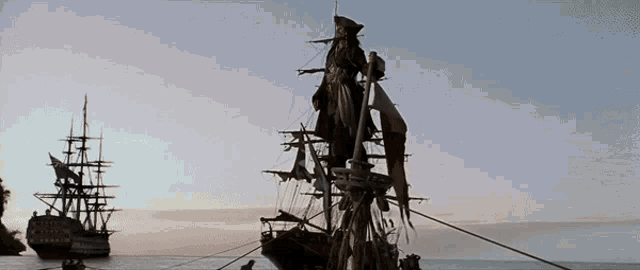 Gif of Captain Jack Sparrow arriving in dock as his ship sinks beneath him.