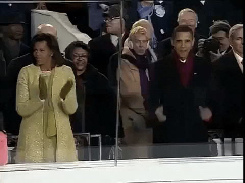 GIF of Michelle and Barack Obama clapping and dancing