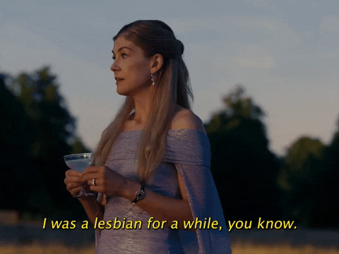 GIF of Rosamund Pike in Saltburn drinking a martini and saying 'I was a lesbian for a while, you know, but it was all just too wet for me in the end. Men are so lovely and dry.'