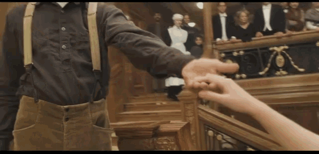 GIF of final scene of Titanic in which Jack and Rose embrace on the grand staircase.