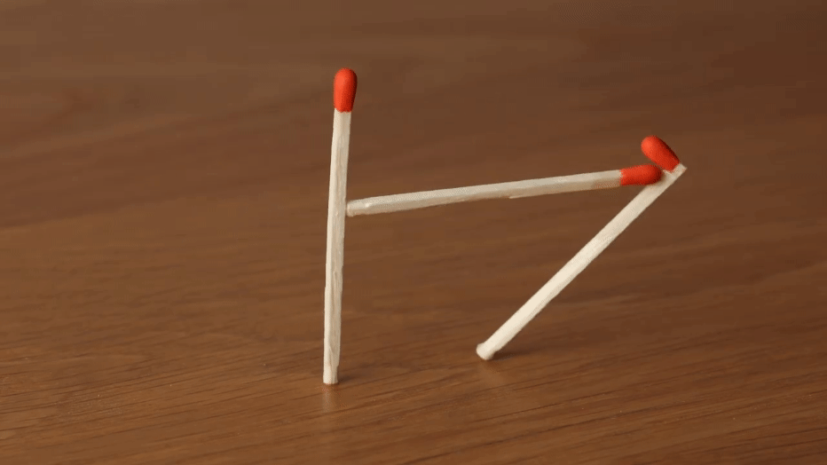 A gif from a stop-motion animation video of matches moving around and performing tricks, showing three matches that appear to be in the middle of a tug-o-war game.