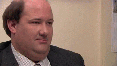 Kevin The Office GIF - Kevin The Office Smirk GIFs