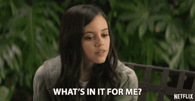 a girl sitting on a bench with a netflix logo in the background