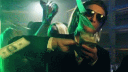 Video gif. A man in sunglasses casually swipes bills off the top of a stack of money as it rains down around him. 