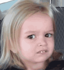 Gif of small child looking pensive and confused
