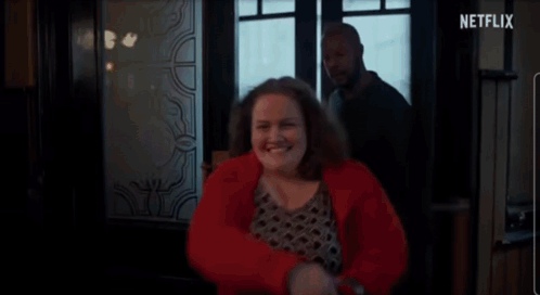 GIF of Martha from Baby Reindeer showing up at a bar in a variety of different outfits