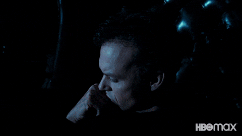 Michael Keaton as Bruce Wayne sitting and thinking until he hears the Bat Signal, and rises to meet the challenge.