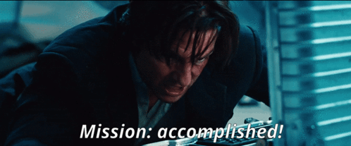 a man in a suit with the words mission accomplished on the bottom a man in a suit with the words mission accomplished on the bottom
