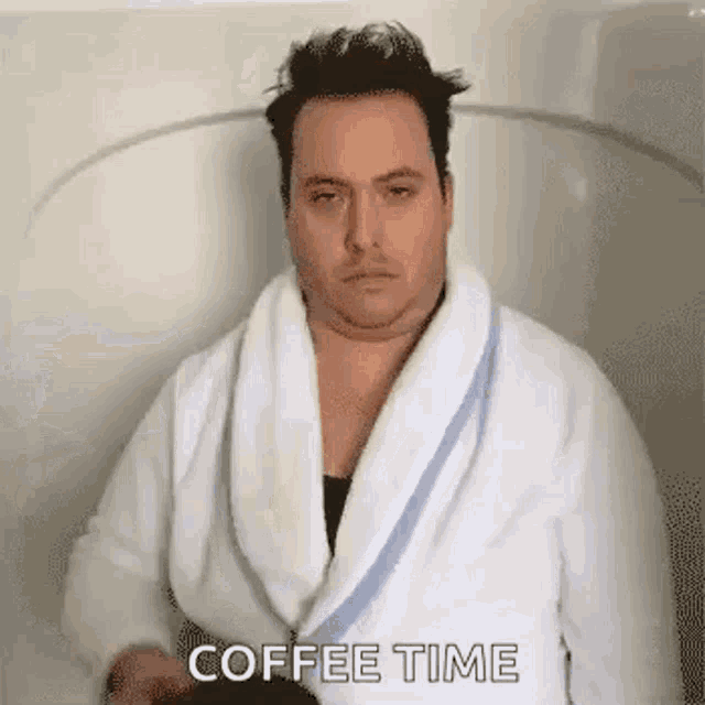 A guy in white bathrobe ouring coffee on himself