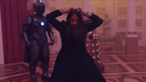 This GIF (repeated moving image) shows the Master (played by Sacha Dhawan), masquerading as Grigori Rasputin, dancing to Boney M.'s 1978 song "Rasputin." The Master, surrounded by Cybermen and Daleks, enjoys his jig inside the Romanov dynasty's Winter Palace in the year 1916. This GIF (repeated moving image) shows the Master (played by Sacha Dhawan), masquerading as Grigori Rasputin, dancing to Boney M.'s 1978 song "Rasputin." The Master, surrounded by Cybermen and Daleks, enjoys his jig inside the Romanov dynasty's Winter Palace in the year 1916.