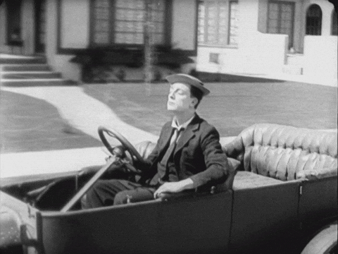 Buster Keaton is driving along in a car ... until it hits a small bump and the whole car falls apart from under him!