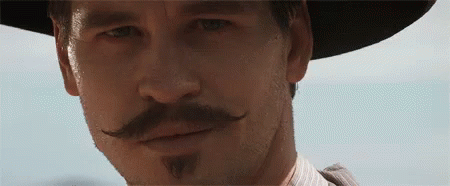 Tombstone Doc Holliday GIF - Tombstone Doc Holliday Wink - Discover & Share  GIFs