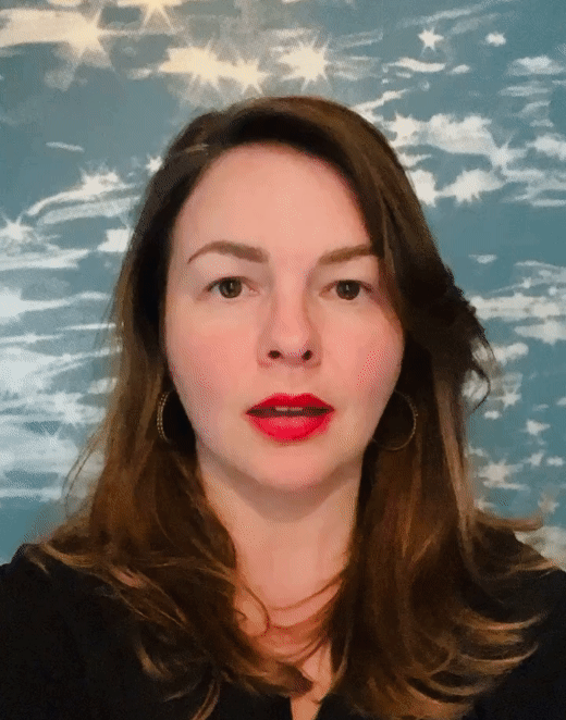A gif of Amber Tamblyn taking a breath in, closing her eyes, then exhaling and opening her eyes.