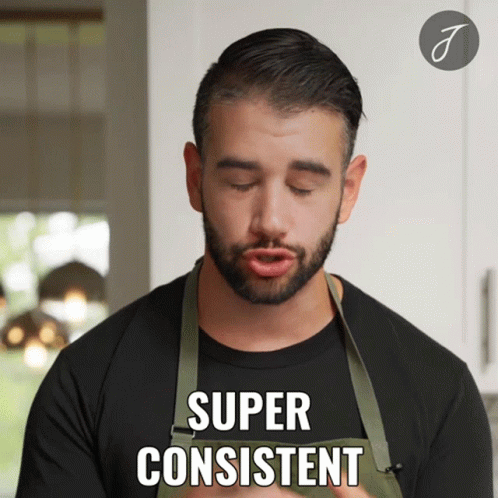 a man with a beard wearing an apron says super consistent