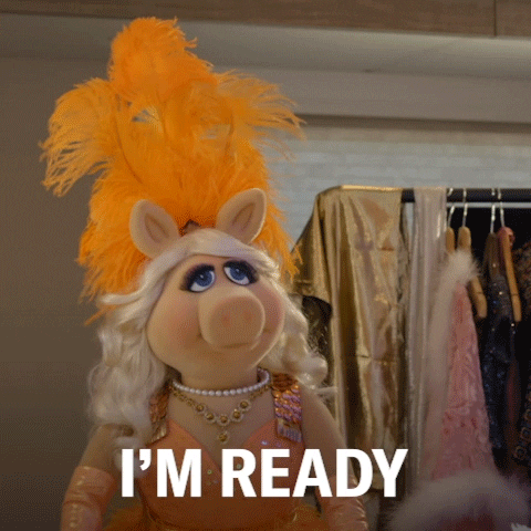 Miss Piggy wears a spangly gown and an orange plumed headdress and announces: "I'M READY." How could you not love this girl? 