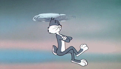 Gif di Bugs Bunny di profilo con gli occhi chiusi,una gamba accavallata sull'altra mentre fluttua in aria con le orecchie che girano come un'elica. Sfondo azzurro del cielo con qualche nuvoletta bianca.