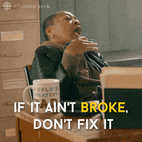 Gif of Ronnie Lee from Schitt's Creek, gesturing at a desk, saying "if it aint' broke, don't fix it"