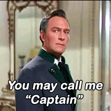 GIF of Christopher Plummer as Captain Von Trapp looking imperious while saying 'You may call me "Captain"'