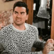 Gif of David from Schitt's Creek making a disgusted face