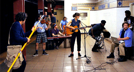 Band in a subway running from the police