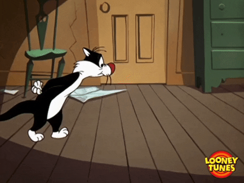 Looney Tunes gif of Sylvester pacing back and forth