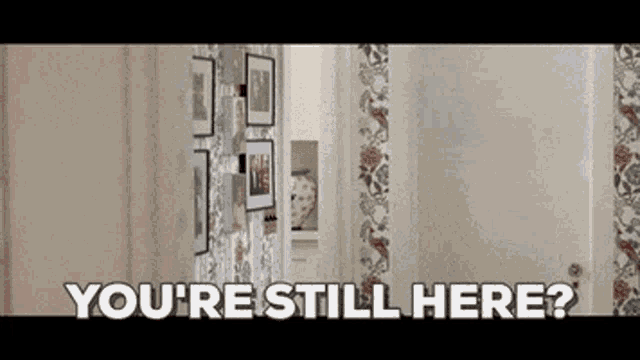 a picture of a hallway with the words " you 're still here "