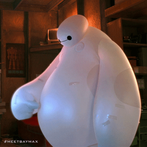 Movie gif. Baymax from Big Hero 6 looks down at his soft belly as he pokes it repeatedly with his finger.