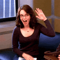 TV gif. Tina Fey as Liz on 30 Rock smiles and gives herself a high five.