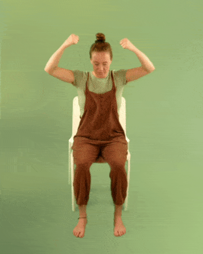 Woman sitting widening and bringing together her arms in exercise