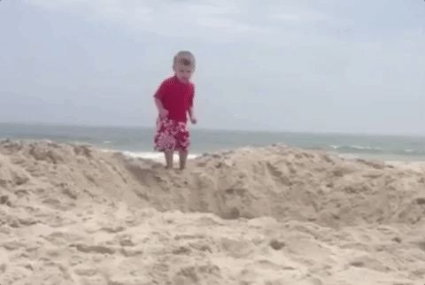 Trending GIF beach jump kid dive hole tot dive in jump in here i go jumping  in diving in | Bambini