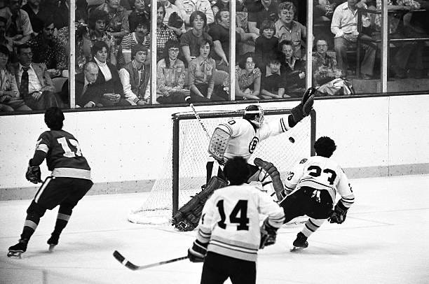 Gerry Cheevers of the Boston Bruins misses shot skates against the Los Angeles Kings at Boston Garden.