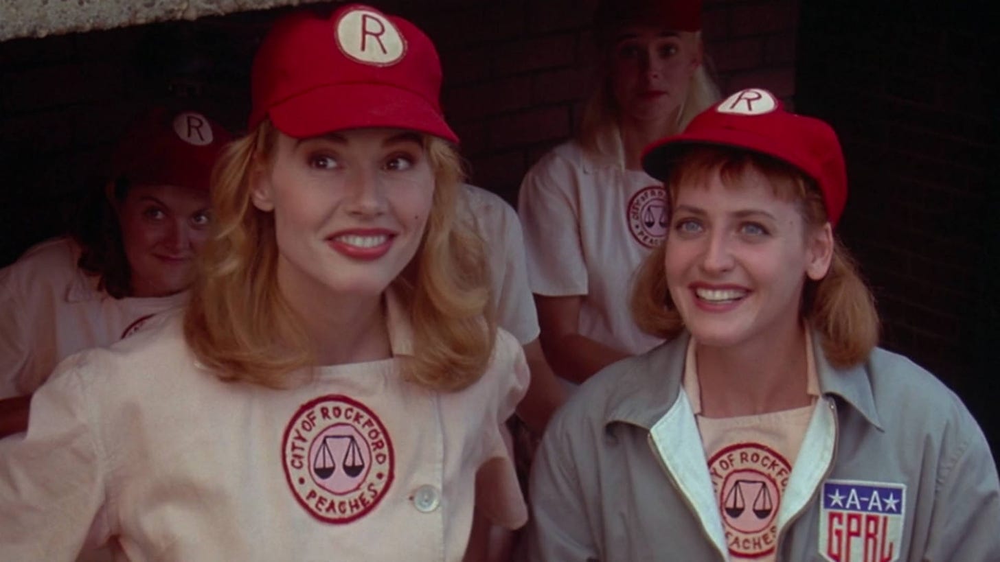 Geena Davis and Lori Petty as Rockford Peach baseball players in A League Of Their Own