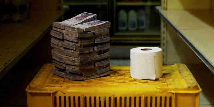 Money and toilet paper placed on a plastic box