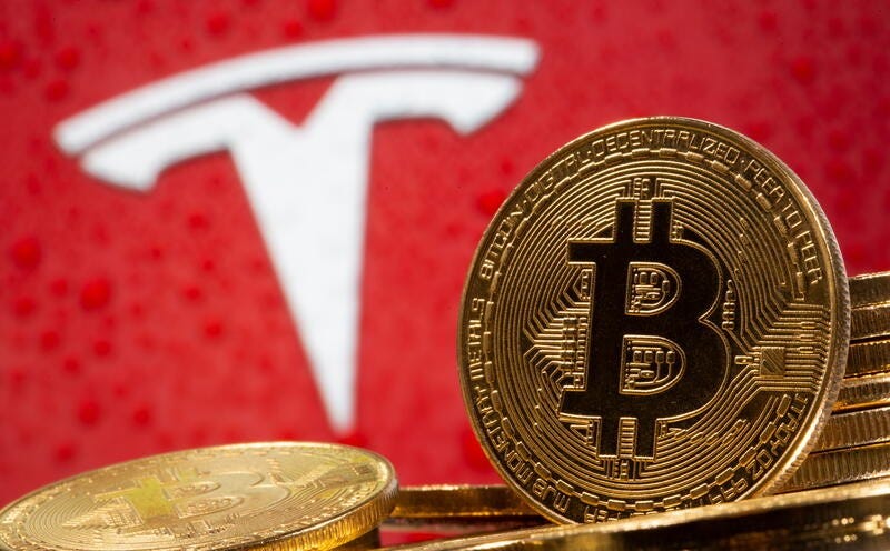 Bitcoin tops $40,000 after Musk says Tesla could use it again | Reuters