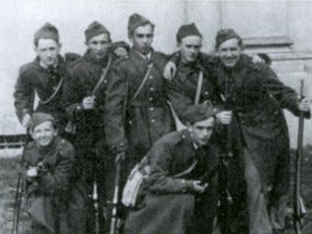 Alexander Topolski, crouching on the left, with school buddies, 1939.