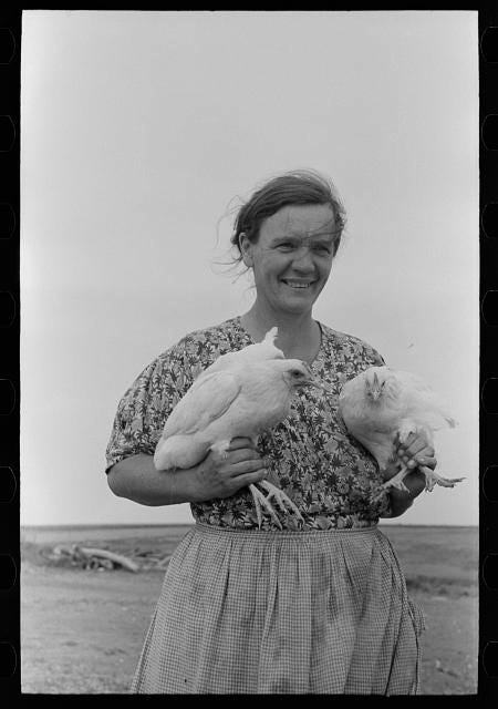 Photo of woman holding two chickens, courtesy of Library of Congress