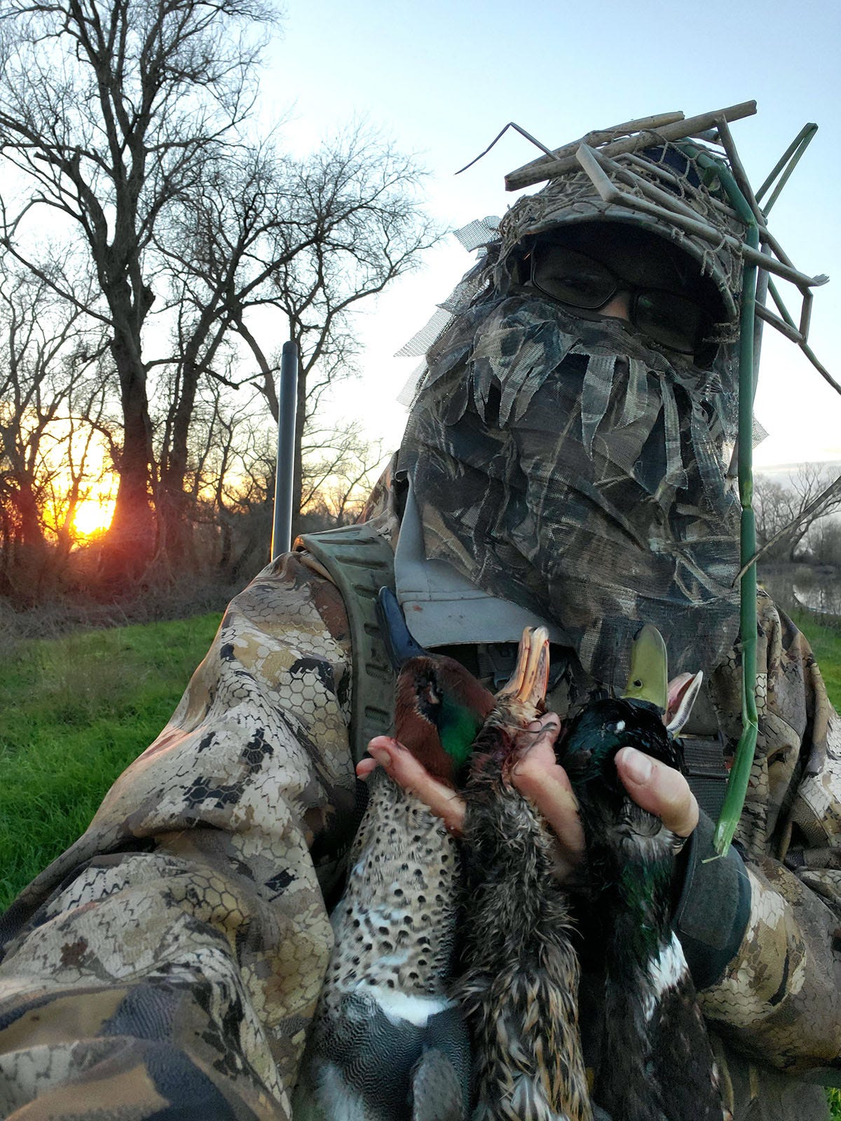 Woman in camo with ducks