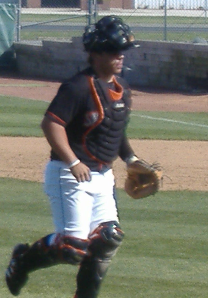 Shorebird catcher Victor Castillo returns to the plate after a mound conference in a recent contest.