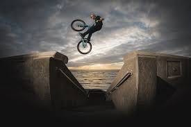 Danny MacAskill performing a crazy stunt on his bike.