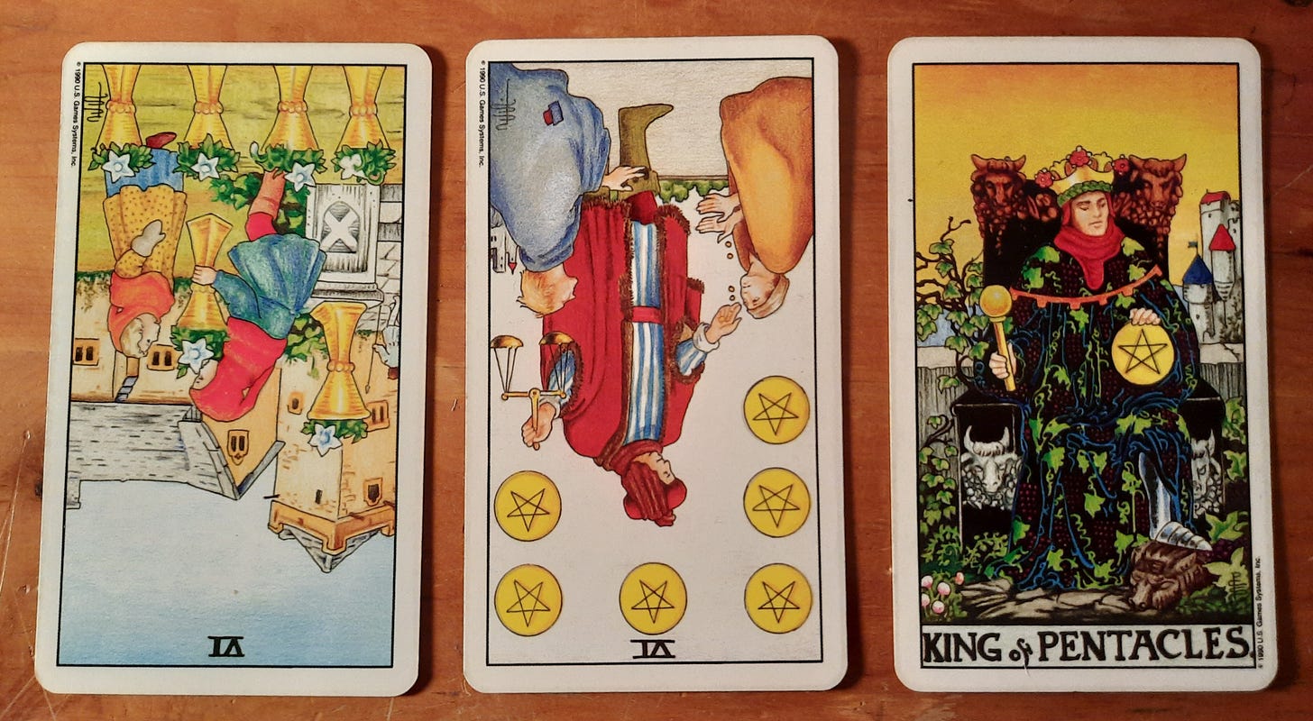 Three card tarot spread - 6 of cups rx, 6 of pentacles rx, king of pentacles. RWS deck. 
