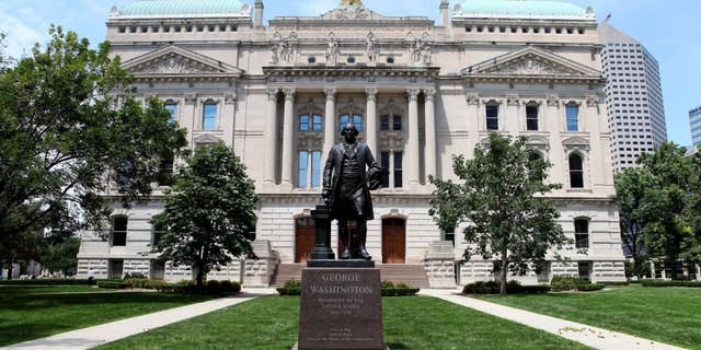 A George Washington statue stands outside the Indiana State Capitol Building on July 16, 2015, in Indianapolis, Indiana.